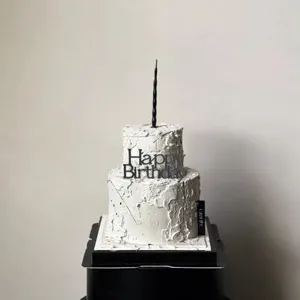 Minimalist acrylic Happy Birthday cake topper with black candle for minimalist baking decor.