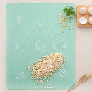 Silicone kneading mat for baking with measurement scales and non-slip surface, green design.