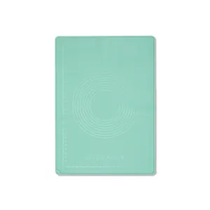 Non-stick silicone baking mat with measurement scales for rolling dough and pastry preparation.