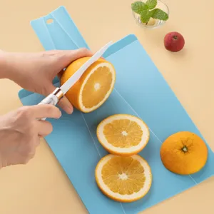 Creative foldable plastic cutting board shovel shaped chopping board for modern kitchen use.
