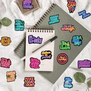 Detailed view of colorful neon affirmation quote stickers, perfect for journal and water bottle.