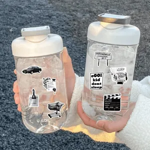 Detail view of aesthetic black and white journal stickers applied on transparent bottles.