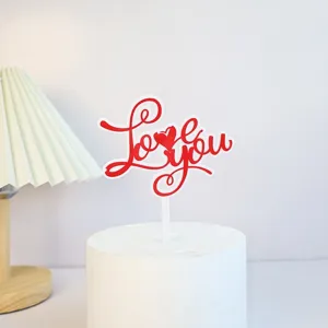 Valentine's Day acrylic cake topper detail showing the red Love you design clearly.