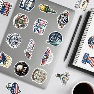Detailed view of waterproof USA 250th anniversary stickers decorated on laptop surface.
