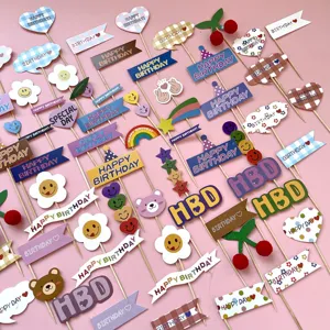 Detailed view of assorted wooden birthday cake toppers, happy birthday letter inserts.