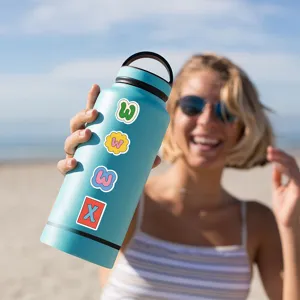 Close-up detail of colorful waterproof cartoon alphabet stickers applied on a blue water bottle.