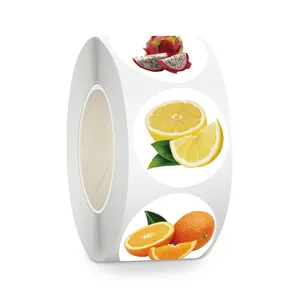 Fruit sticker roll detail showing realistic dragon fruit, lemon and orange designs clearly.