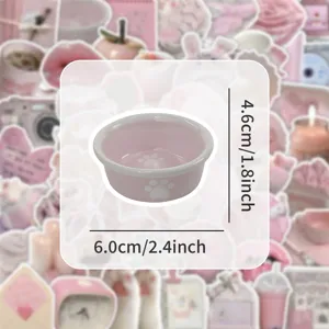 Pink ceramic pet bowl with cute white paw print design, compact size for small cats and dogs.