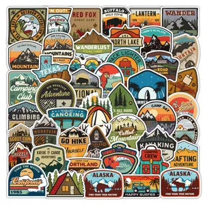 Close-up detail of waterproof outdoor adventure vinyl stickers featuring retro mountain designs.