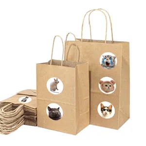 Craft paper bags with funny cat stickers detail view, cute decorative packaging for gifts.