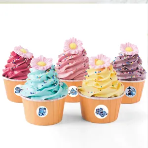 Detailed view of cute cartoon tiger stickers applied on colorful decorative cupcakes.