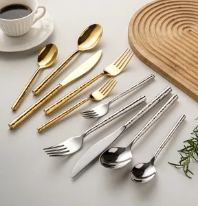 Stainless steel hammered western tableware set including knives forks spoons gold and silver.