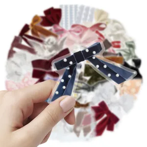 Detail shot of transparent decorative bow sticker with pearls for journaling, phone and laptop.