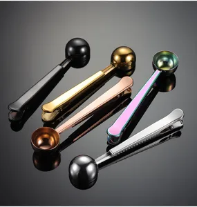 Stainless steel measuring spoon with bag clip, multi-functional coffee scoop detail view.