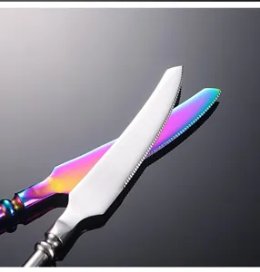 Rainbow stainless steel steak knife close-up detail showcasing vibrant titanium coating.