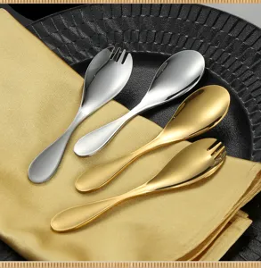 Detailed view of stainless steel mini spoons and sporks set in gold and silver, elegant tableware.