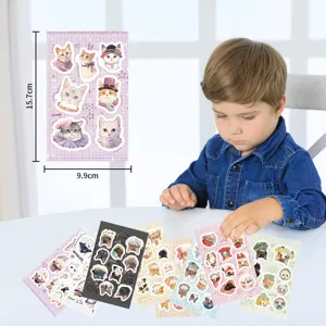 Detail view showing cute cartoon cat decorative stickers on a clean white desk setup.
