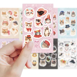 Close-up detail of cute cartoon cat stickers sheet, perfect for journal and notebook decoration.