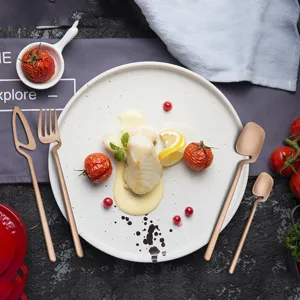 Rose gold stainless steel cutlery set featuring a unique hanging handle design for elegant dining.