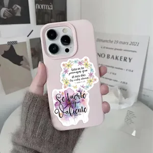 Spanish Bible verse motivational sticker detail showcasing floral and text design on phone.