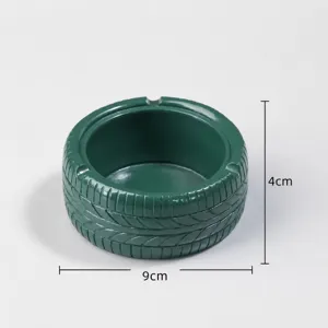 Modern creative resin tire ashtray in dark green, diameter about 9cm, stylish desktop decor.