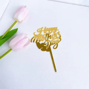 Gold acrylic Happy Mother's Day cake topper detail shot with pink tulip decoration.