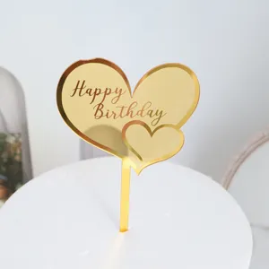 Gold mirror acrylic heart cake topper with Happy Birthday text for birthday party decor.