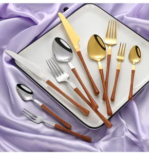 Stainless steel flatware set with wood grain handle, elegant tableware display.