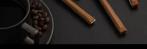 Stainless steel western cutlery detail, wood grain handle design for dining table aesthetic.