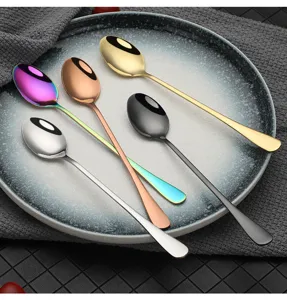 Detailed close-up view of stainless steel long handle spoons in assorted vibrant colors.