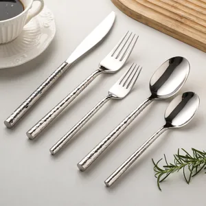 5-piece stainless steel flatware set with elegant hammered round handles for dining.