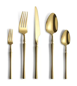 Detailed view of luxury golden stainless steel tableware set, featuring elegant handle curve.