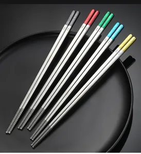 Detail view of 316L stainless steel chopsticks with colorful anti-slip square tips.