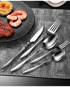 Elegant stainless steel tableware detail showcasing French luxury style cutlery set knife and fork.