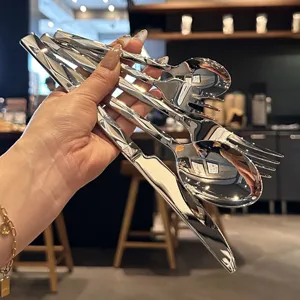 Luxury stainless steel cutlery set with diamond cut handles, elegant knife, fork and spoon.