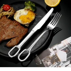 Stainless steel steak knife and fork set with creative hanging hole for western dining.