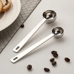 Stainless steel measuring spoon with long handle, ideal for coffee beans and baking use.
