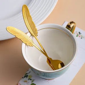 Cuillère à café en acier inoxydable poignée plume dorée élégante vaisselle de dessert