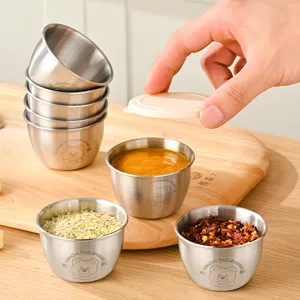Stainless steel dipping sauce cups with lids, ideal for kitchen seasoning and salad dressing.