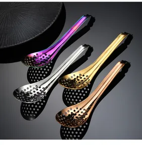 Detailed view of multi-color stainless steel caviar slotted spoons for molecular gastronomy.