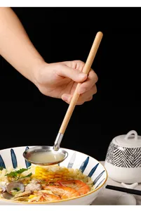 Japanese style stainless steel soup ladle with wooden handle detail shot for kitchen cooking tools.