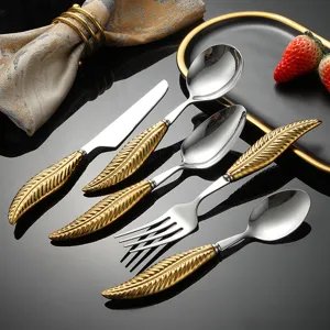 Luxury 304 stainless steel flatware set with elegant gold feather handles, 5-piece western tableware.
