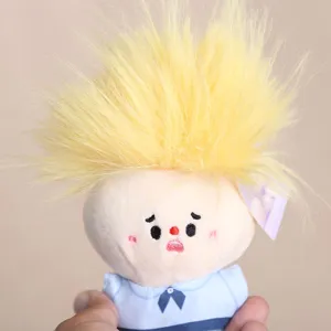 Cute plush doll pendant with spiky yellow hair and blue shirt, lovely bag hanging ornament.