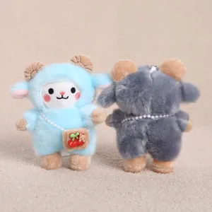 Cute ram plush keychain detail showing blue and grey sheep with pearl cross-body cherry bag.