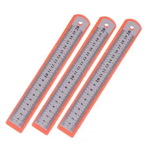 Detailed view of 20cm stainless steel rulers with orange backing and clear scale markings.