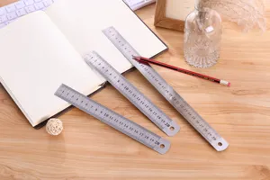 Stainless steel ruler detail shot showing metallic texture and clear metric scale markings.