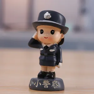 Mini police officer figurine model doll for car decoration, cake topper, and festival gift.
