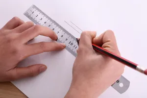 Stainless steel ruler detail view, showing clear metric scale measurements for office work.