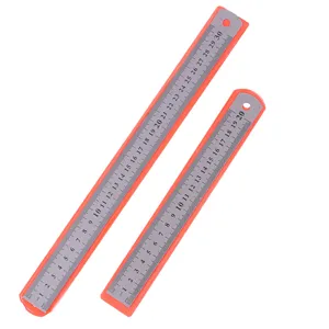 Stainless steel ruler detail view, metal measuring tool closeup, clear scale markings.