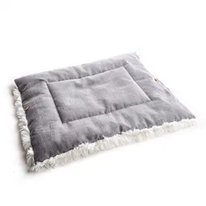 Grey plush pet mat detail close up with soft white faux fur trim for cozy cat and dog resting.